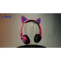 Auriculares coloridos de moda con orejas de gato con luces parpadeantes